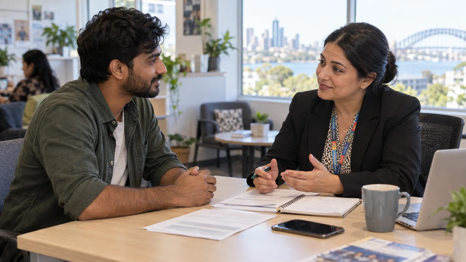 Indian-Australian worker receiving workplace rights advice at a Sydney community support centre